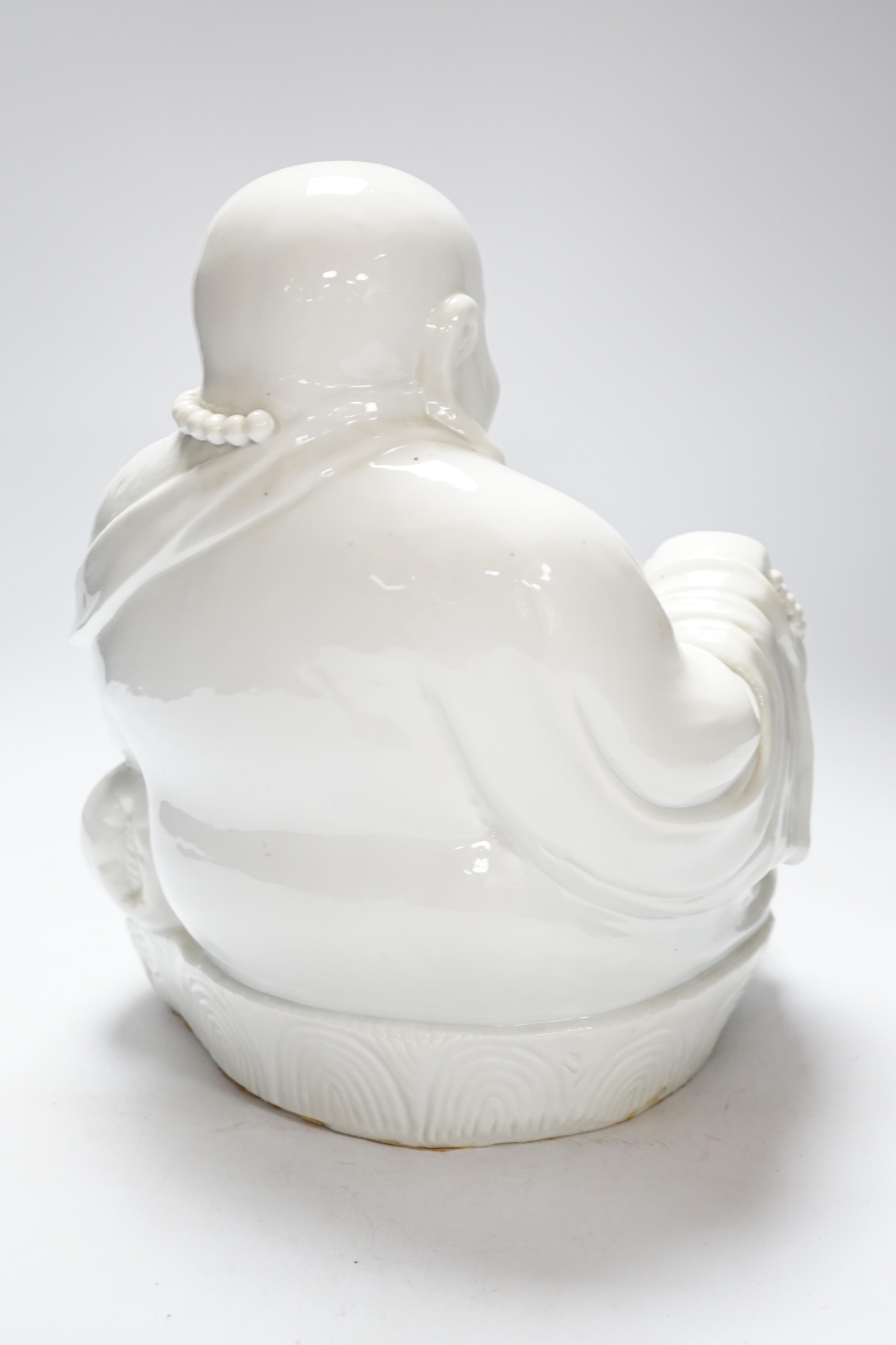 A Chinese Blanc de chine figure of Budai, 32cm high
